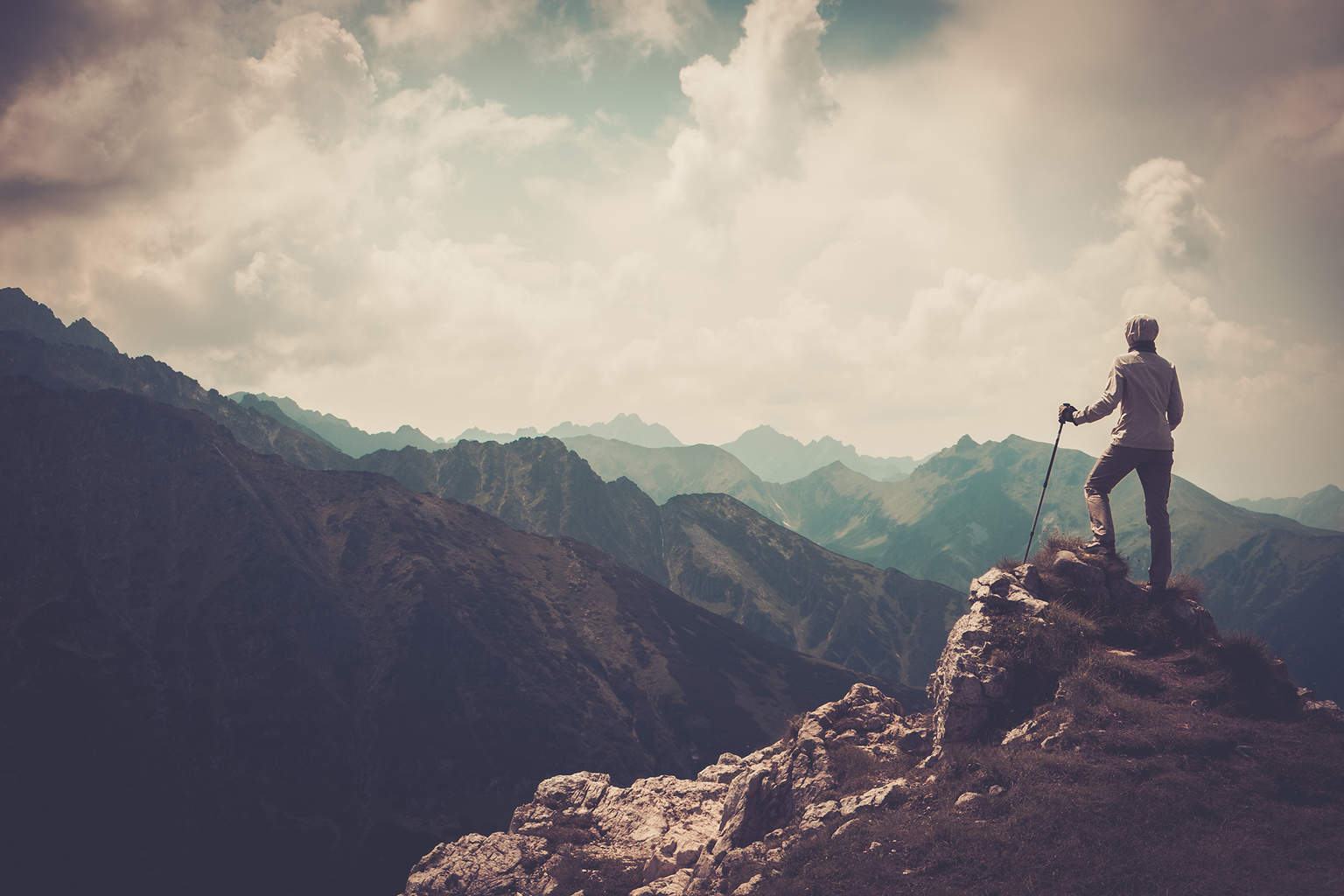 Woman hiker on a top of a mountain - Go Hike It